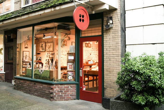 Button and Needlework Boutique storefront and yarn display.