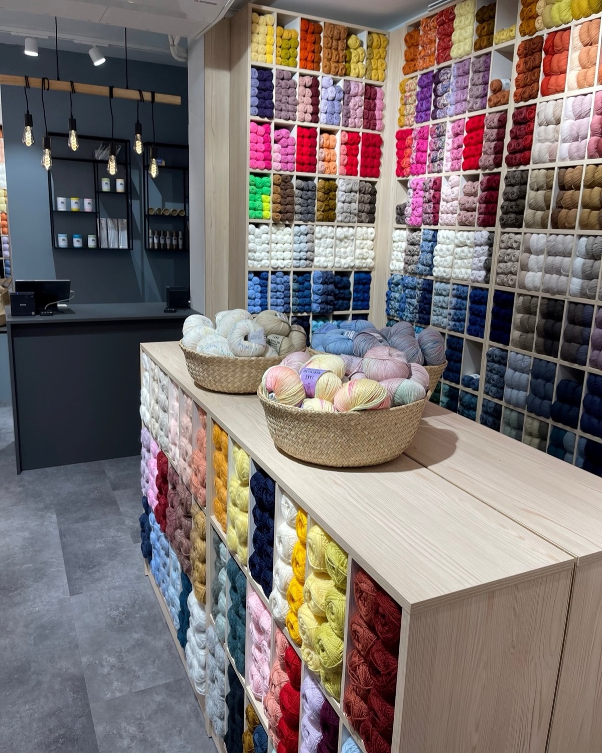 Floor-to-ceiling yarn wall inside Tjorven Garn in Oslo.