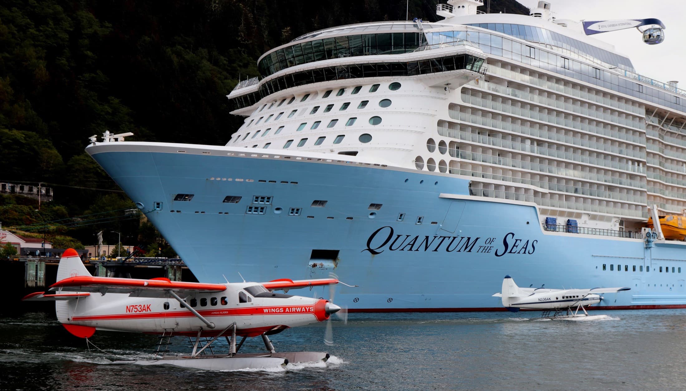Quantum of the Seas cruise ship docked in harbor.