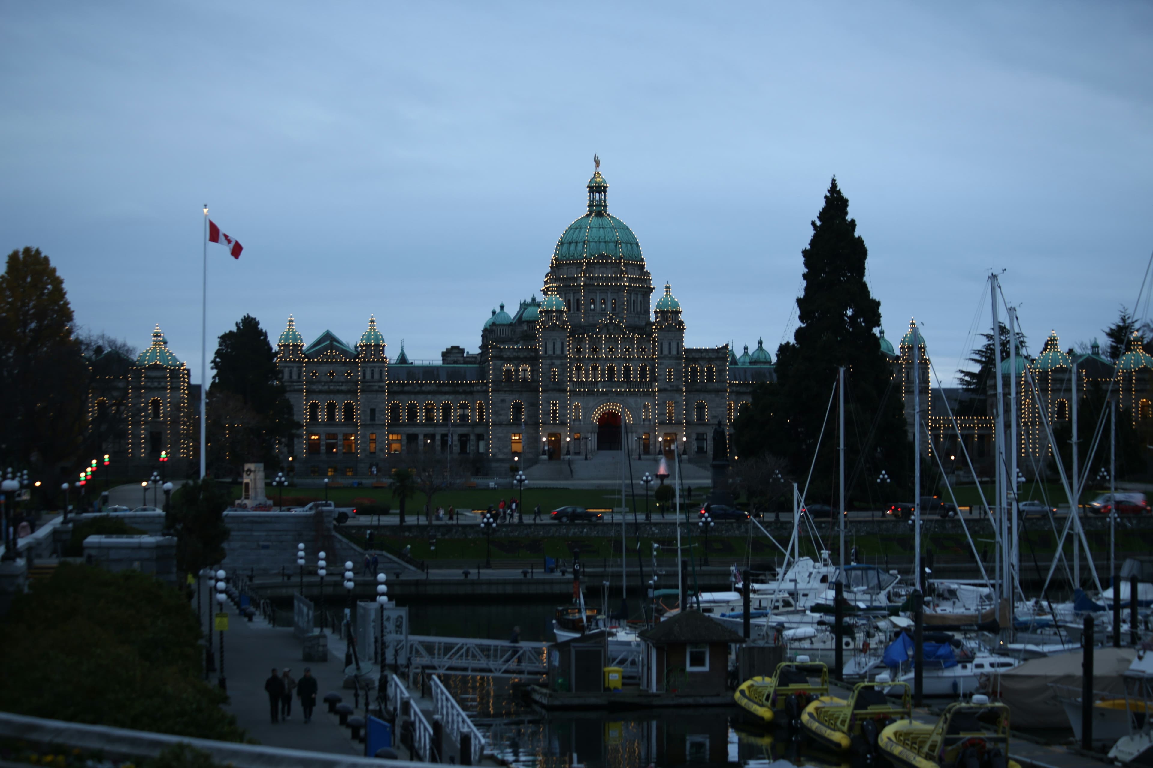 Victoria Inner Harbour and legislative buildings at dusk.